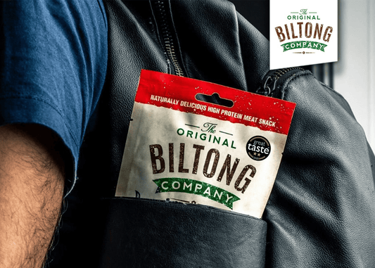 Athlete holding biltong as a high-protein snack for muscle recovery and fitness nutrition
