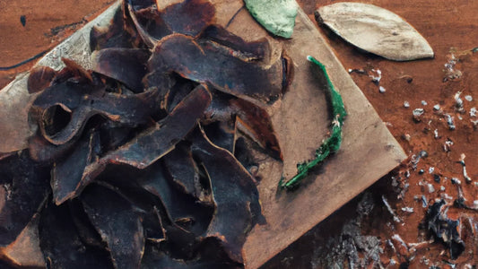 Sliced biltong on a wooden chopping board, showing its dark colour and dried texture.