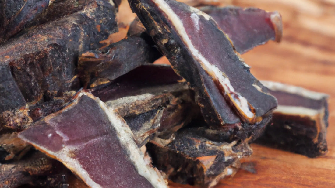 Sliced biltong on a rustic wooden board