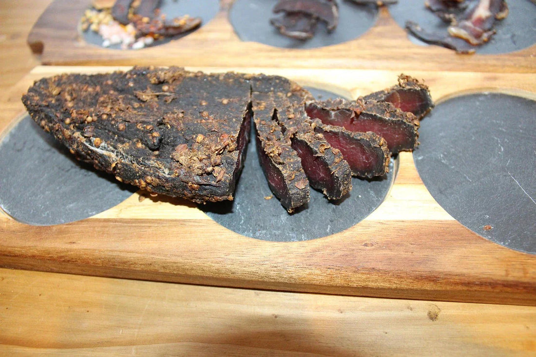 Sliced biltong on serving board. Biltong serving suggestion. Picnic snack ideas
